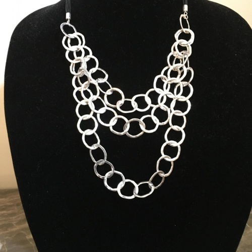 Leather necklace with large silver triple drop necklace